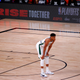Giannis Antetokounmpo #34 of the Milwaukee Bucks stands in front of the NBA ESPN Rise Together signage during the second quarter in Game Five of the Eastern Conference First Round against the Orlando Magic during the 2020 NBA Playoffs at AdventHealth Arena at ESPN Wide World Of Sports Complex on August 29, 2020 in Lake Buena Vista, Florida.